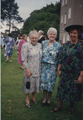 Photograph of a group taken at the 60th Summer School garden party