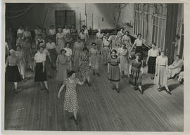 Photograph of Tihi West teaching the Ladies' Highland Class, in St Katherine's gym hall