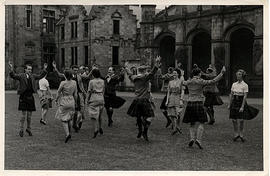 Photograph of people set dancing in the quad during Summer School