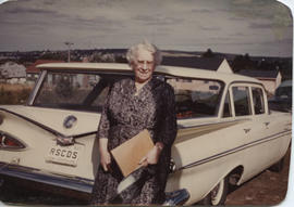 Photographs of Jean Milligan and others posing in front of cars with RSCDS number plates