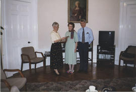 Photograph of Linda Gaul and Alan MacPherson being presented with Maggie MacDonald's notebook