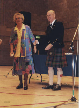 Photograph of Bessie Kemp (Teeside) receiving a scroll from Bill Clement