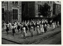 Photograph of a group dancing a Foursome reel, outside