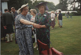 Photograph of Wilma Miller and Anna Holden taken at the 60th Summer School garden party