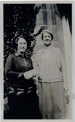 Sepia photograph of Jean Milligan and Ysobel Stewart outside University Hall, St Andrews