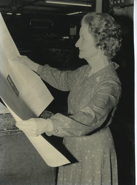 Photograph of Muriel Gibson examining the proofs of Dance with your Soul