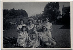 Photograph of a group of women sitting outside