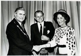 Photograph of Muriel Gibson being presented with keys to a car and a broach ion her retirement. L...